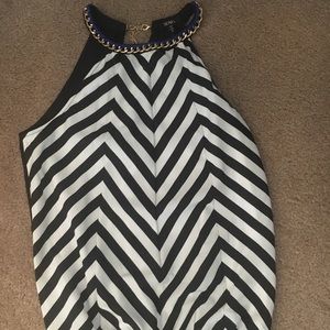 Chevron tank with gold chain around neck